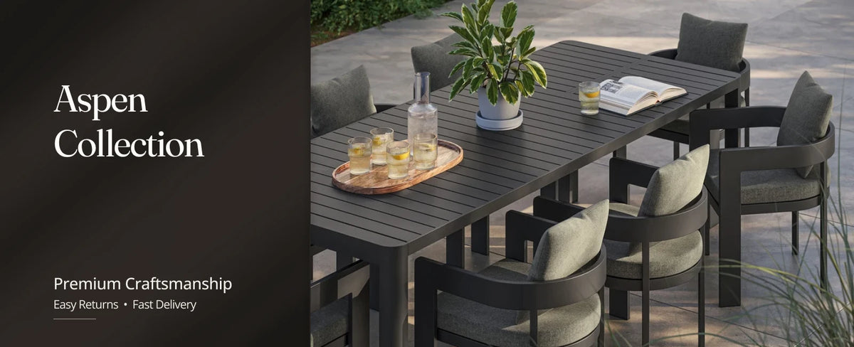 Aspen collection aluminum patio furniture set with a sofa, two armchairs, and a coffee table on a covered patio.