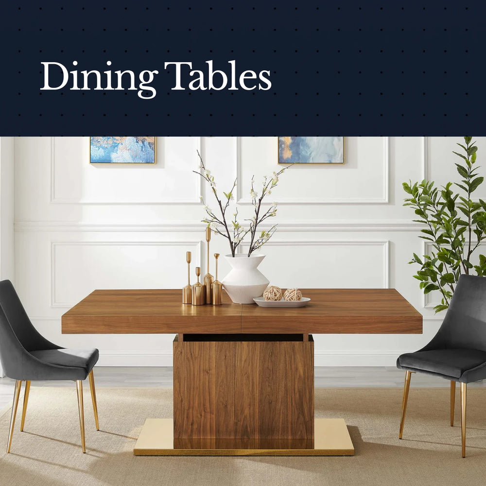 Wooden dining table with two gray chairs in a room with white walls and decorative elements.