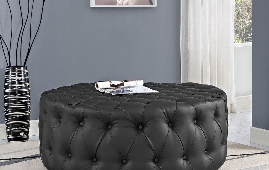 Alder Upholstered Vinyl Ottoman in Black