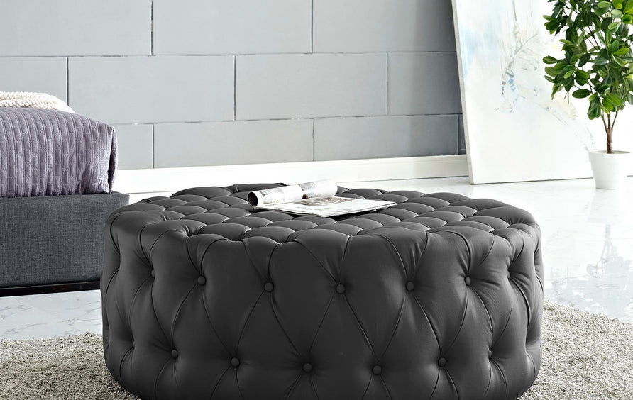 Alder Upholstered Vinyl Ottoman in Black