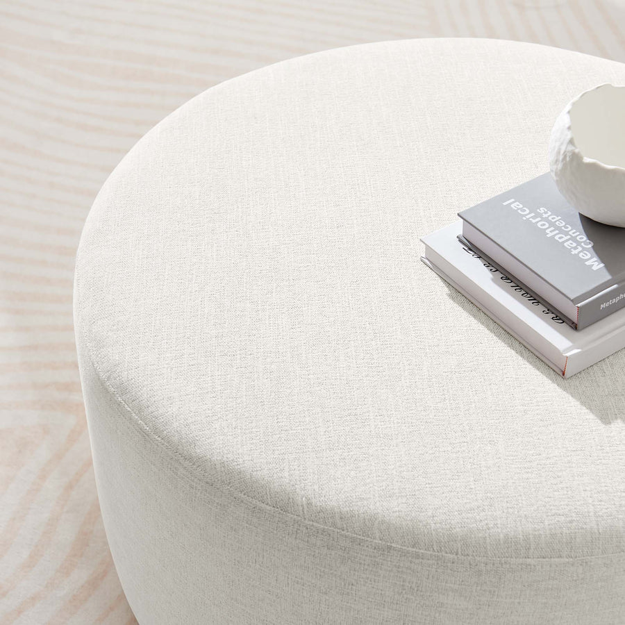 Oren Large 29" Round Woven Heathered Fabric Upholstered Ottoman in Heathered Weave Ivory