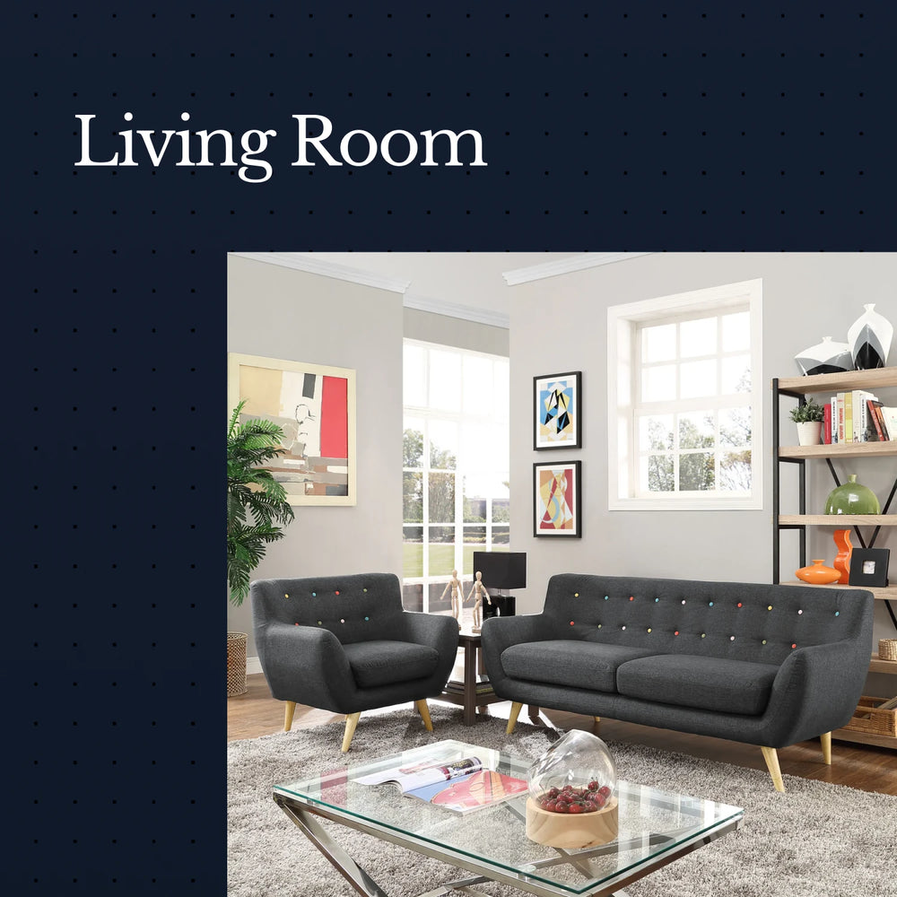 Living room with gray sofa and armchair, glass coffee table, and decor elements.