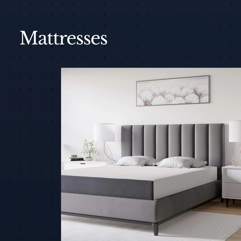 Gray mattress on a bed with a decorative headboard and wall art in a bedroom setting.