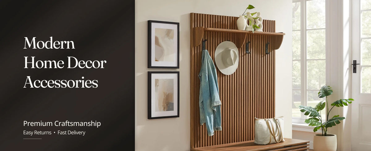 Modern wood entryway organizer with wall hooks, shelf, framed artwork, and decorative home accessories.