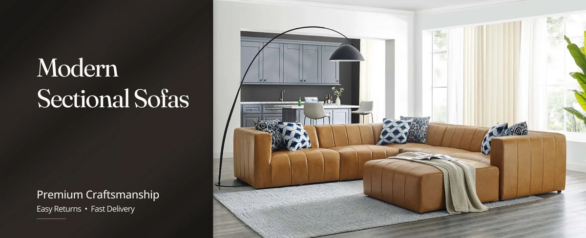  Modern sectional sofa with a chaise and soft cushions in a contemporary living room.